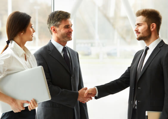 a few business people shaking hands